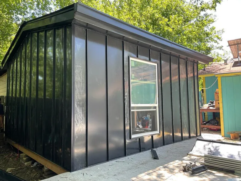 Black standing seam metal wall panels for Roof Inspection in Easton